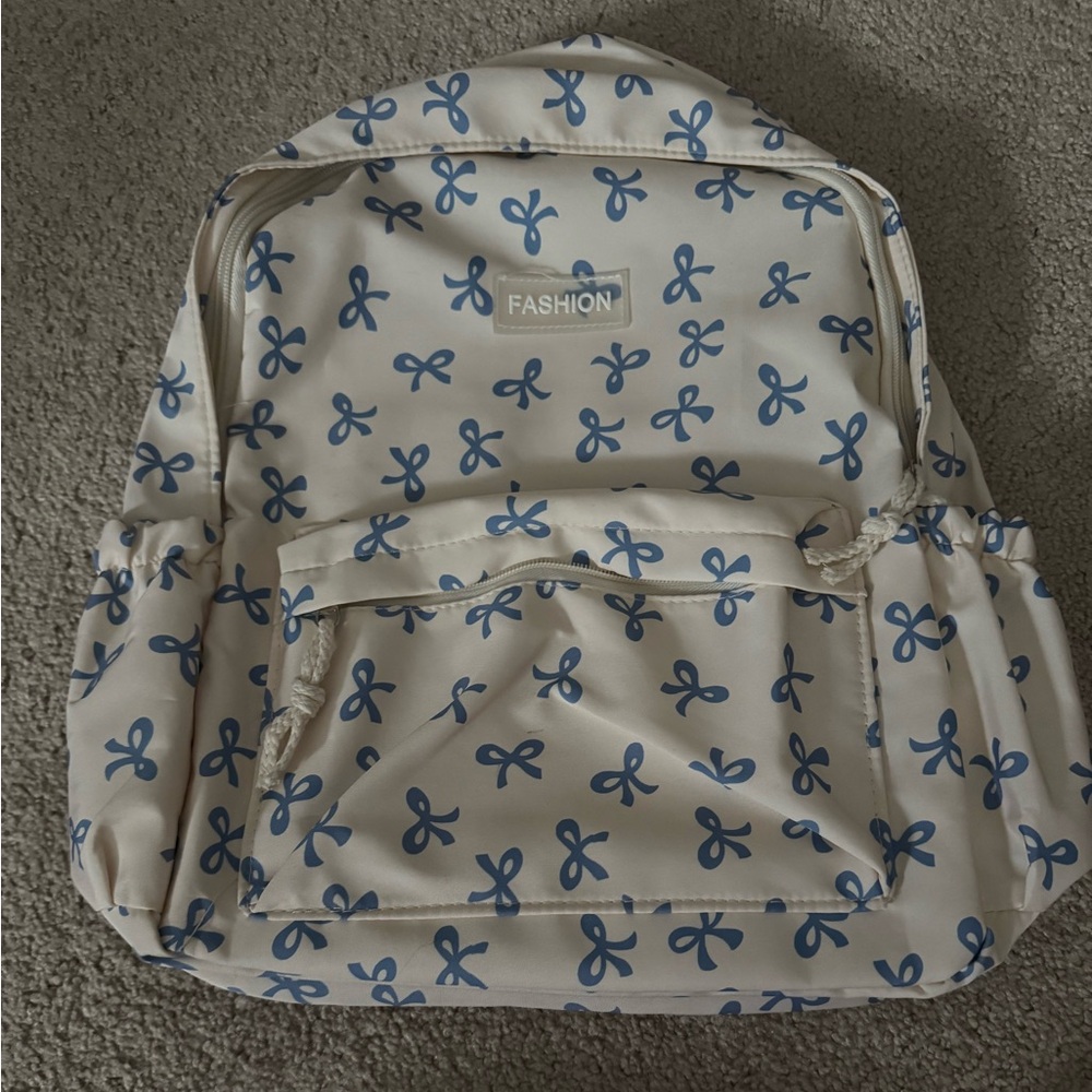 Blue and Cream Bow Pattern Backpack